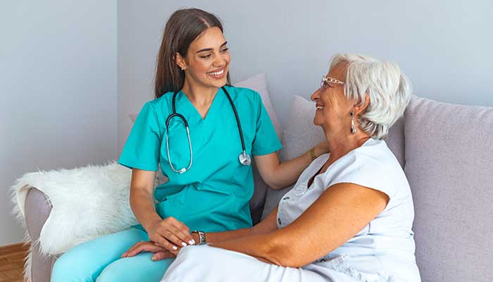 A nurse checking in on a patient